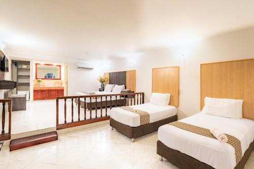 Ένα ή περισσότερα κρεβάτια σε δωμάτιο στο Hotel Americas San Andres Islas Colombia