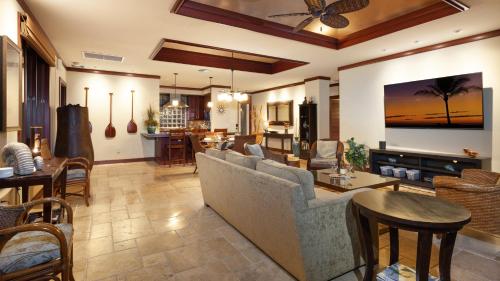 a living room with a couch and a table at ❤PiH❤ Ocean Palms Villa Stunning Ocean View Mauna Kea Resort in Hapuna Beach