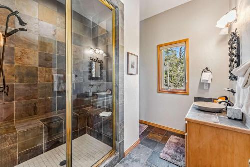 a bathroom with a shower and a sink at Highlands Ridge Retreat Massive 9 BDR Estate in Breckenridge