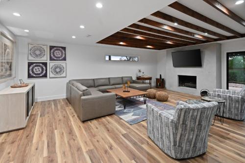 a living room with a couch and a table at Guadalupe Bluff Mediterranean in Kerrville