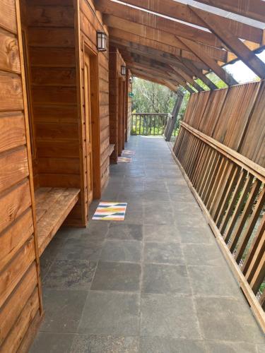 an empty hallway in a wooden building with a walkway at Espacio Ecole in Pucón