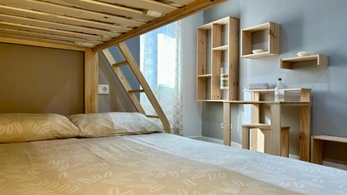 a bedroom with a bed with a wooden ceiling at Apartamento Moderno y Amplio con Vistas a la Bahía in Algeciras