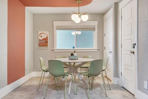 a dining room with a table and chairs at Institute Aura! Family Home w Quiet Workspace in Colorado Springs