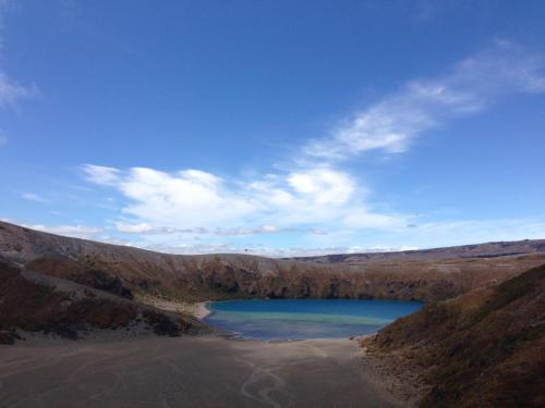 a lake in the middle of a hill at Manowhenua Lodge in National Park