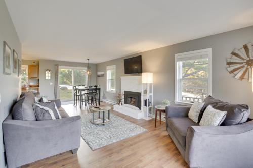 a living room with two couches and a fireplace at 6 Mi to Sunday River Condo Near Bethel Village! in Bethel