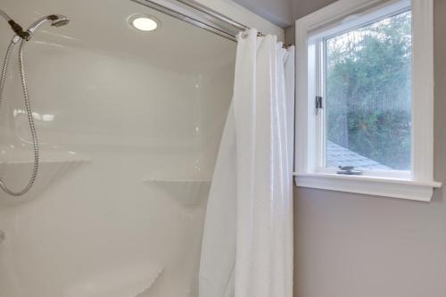 a shower curtain in a bathroom with a window at 6 Mi to Sunday River Condo Near Bethel Village! in Bethel
