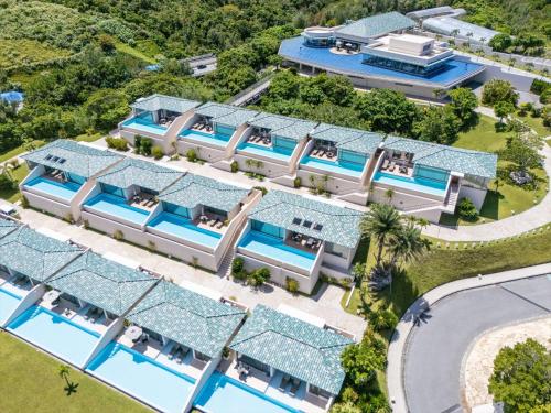 an aerial view of a villa with swimming pools at Oriental Hills Okinawa in Onna