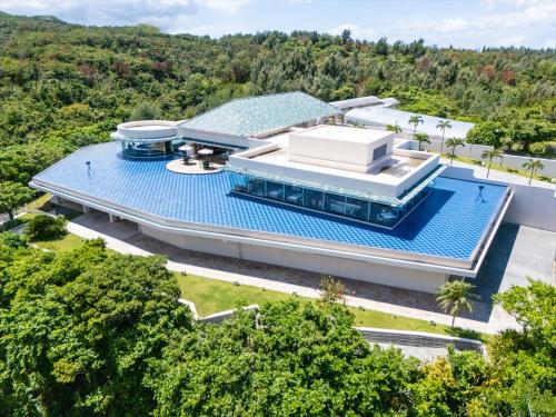 an overhead view of a building with a swimming pool at Oriental Hills Okinawa in Onna