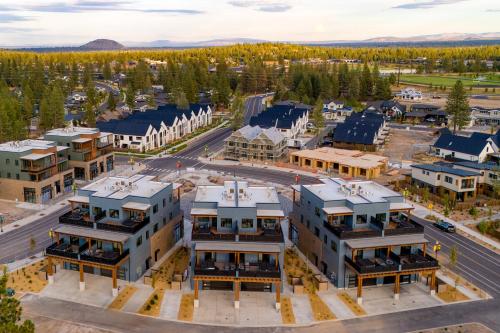 an aerial view of a city with buildings at The Aerie Suites by AvantStay Modern Comfort with Mountain Views in Bend