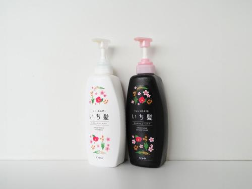 two bottles of shampoo and conditioner sitting next to each other at Rembrandt Cabin Shinjuku Shin-Okubo in Tokyo