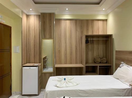 Ένα ή περισσότερα κρεβάτια σε δωμάτιο στο Hotel Campos