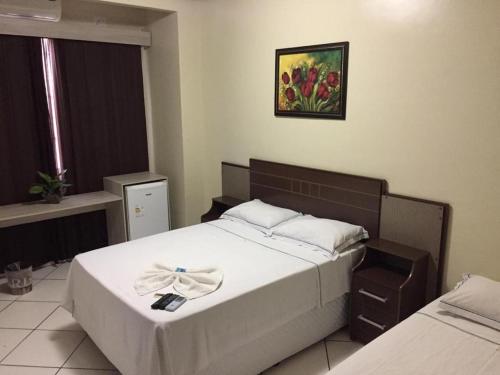 Ένα ή περισσότερα κρεβάτια σε δωμάτιο στο Hotel Campos
