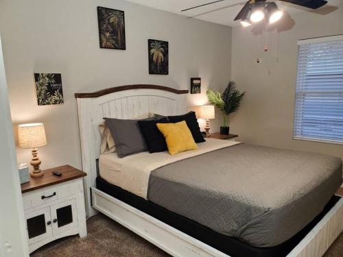 a bedroom with a bed and a table with a lamp at Tranquil Mesa Retreat in Mesa