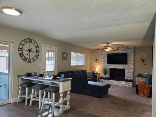 a living room with a couch and a table at Tranquil Mesa Retreat in Mesa