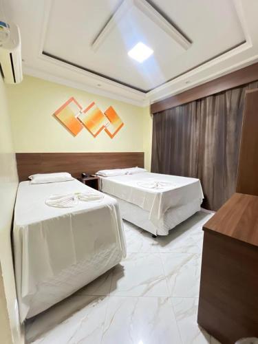Ένα ή περισσότερα κρεβάτια σε δωμάτιο στο Hotel Campos