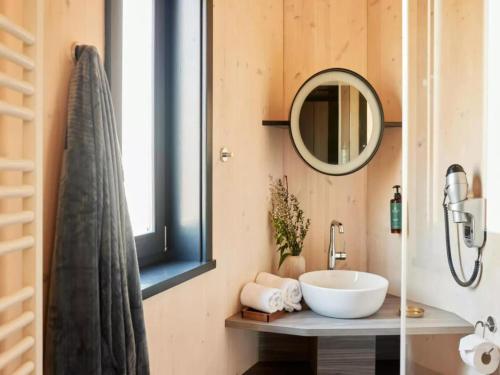 a bathroom with a sink and a mirror at Forest View Escape for Two in Antoing