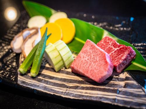 a bunch of different types of food on a grill at Oriental Hills Okinawa in Onna