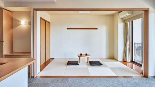 a room with a table in the middle of a room at Tokyu Vacations Izukougen in Ito