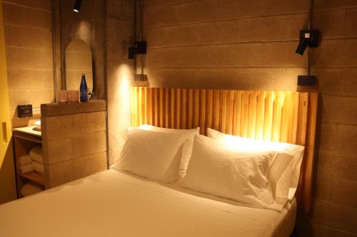 Cytrico Hotel Laureles Estadioにあるベッド