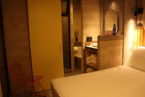 Cytrico Hotel Laureles Estadioにあるベッド