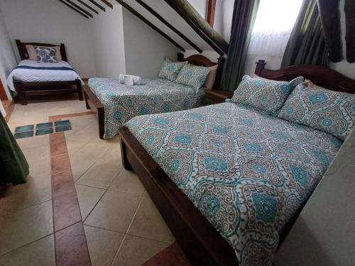 Ένα ή περισσότερα κρεβάτια σε δωμάτιο στο Mar y Luz Casita Hotel