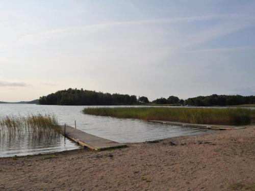 a dock in the middle of a body of water at Stunning Home In Strängnäs With 2 Bedrooms in Strängnäs