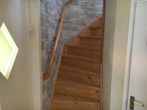 a stairway with wooden steps in a room at Awesome Home In Motala With Wifi And 0 Bedrooms in Motala