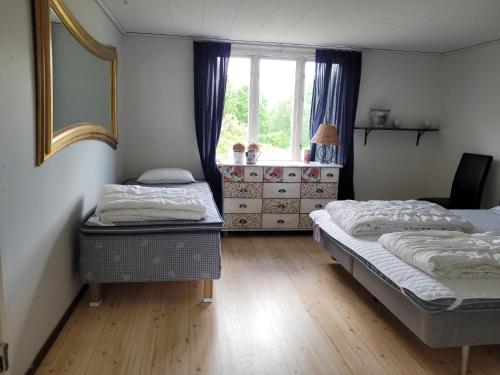 Beautiful Home In Hamneda With 4 Bedrooms And Wifiにあるベッド