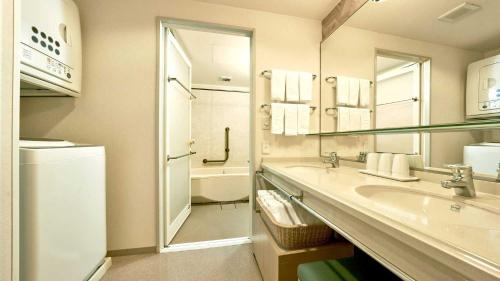 a bathroom with a sink and a shower and a toilet at Tokyu Vacations Hakone Gora in Hakone