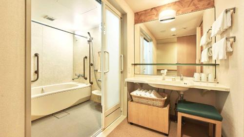 a bathroom with a tub and a sink and a shower at Tokyu Vacations Hakone Gora in Hakone