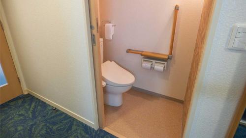 a bathroom with a toilet and two rolls of toilet paper at Tokyu Vacations Hakone Gora in Hakone