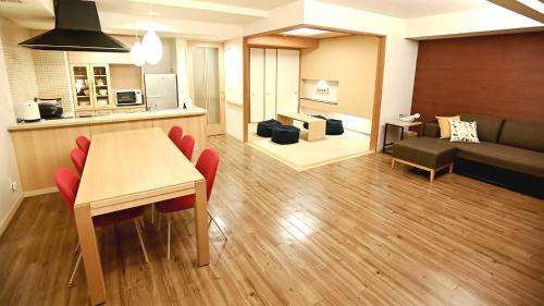 a kitchen and living room with a table and chairs at Tokyu Vacations Hakone Gora in Hakone