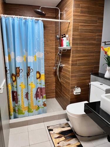 a bathroom with a shower curtain with animals on it at The RADIANCE MANILA BAY in Manila