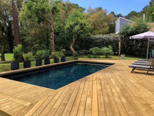 Photo de la galerie de l'établissement Villa de luxe avec piscine chauffée et salle de sport - FR-1-791-10, à Seignosse