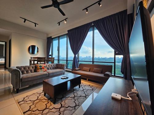 a living room with a couch and a table at Opus Residences by Star Haven in Kuala Lumpur