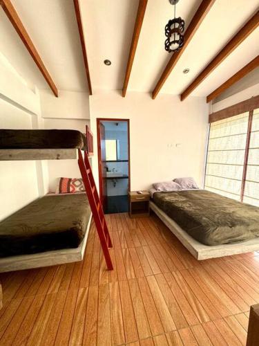 Postel nebo postele na pokoji v ubytování Casa campo Mauri Capacidad 23 personas A 12 minutos del Óvalo de Cieneguilla