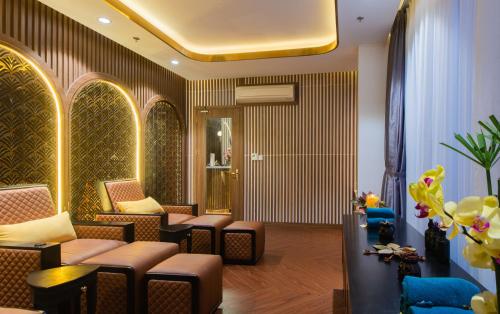 a waiting room with couches and chairs at Grand Tourane Nha Trang Hotel in Nha Trang