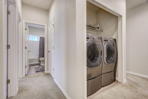 a laundry room with a washer and dryer at Orchid Oasis - 2 Kings Foosball BBQ Fire Pit in Colorado Springs