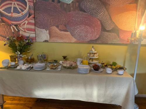 a table with plates of food on it at ENTRE VIÑAS in Santa Cruz