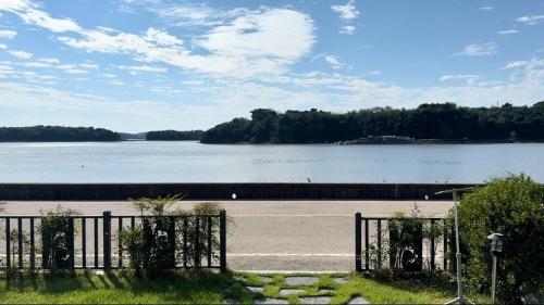 a gate in front of a body of water at Daeboodo Prince Pension in Ansan