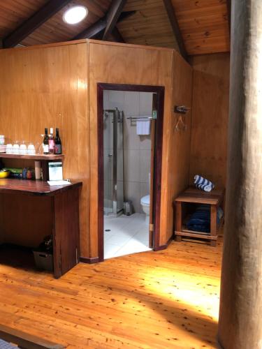 a bathroom with a shower and a toilet in a room at Wildwood in Cape Tribulation
