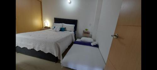 Postel nebo postele na pokoji v ubytování Hermoso apartamento en Sabaneta cerca al parque