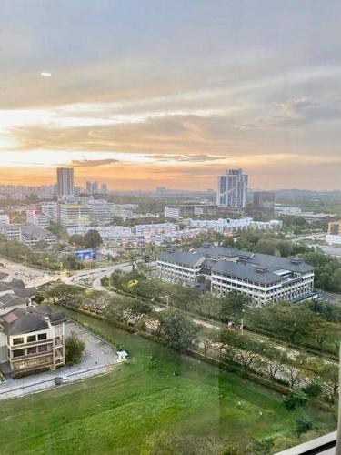 a view of a city with buildings and a park at Cozy Shaftsbury Netflix tv box pakin wifi king bed netflix wifi free parking 1116 in Cyberjaya