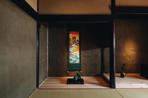 a room with a stained glass window and some vases at RITA Yame Fukushima in Yame