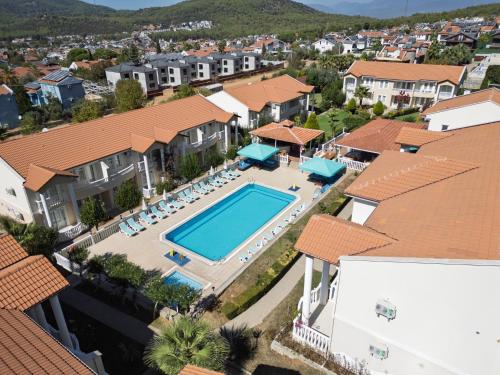 an aerial view of a house with a swimming pool at Larimar Suite Hotel in Oludeniz
