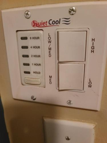 a control panel above a toilet in a bathroom at Westside Retreat w Yard, Grill, Hot Tub, Near Sofi Stadium, LAX, and the Beach in Los Angeles