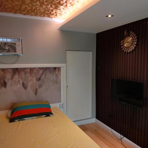 Llit o llits en una habitació de Gerry' Place
