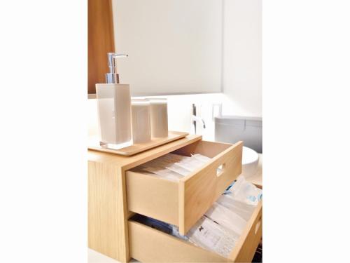 a bathroom with a sink and a wooden drawer at Resort Yufuin - Grandpia Resort YUFUIN - - Vacation STAY 73396v in Yufu