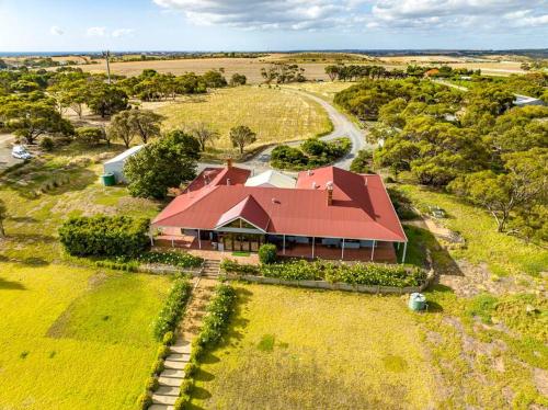 an overhead view of a house with a red roof at Condor Estate Spacious with Vineyard & Fireplace in Maslin Beach
