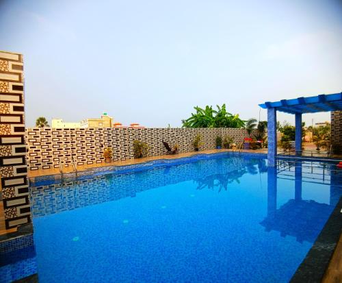 Bazén v ubytování Samriddha Beach Resort nebo v jeho okolí
